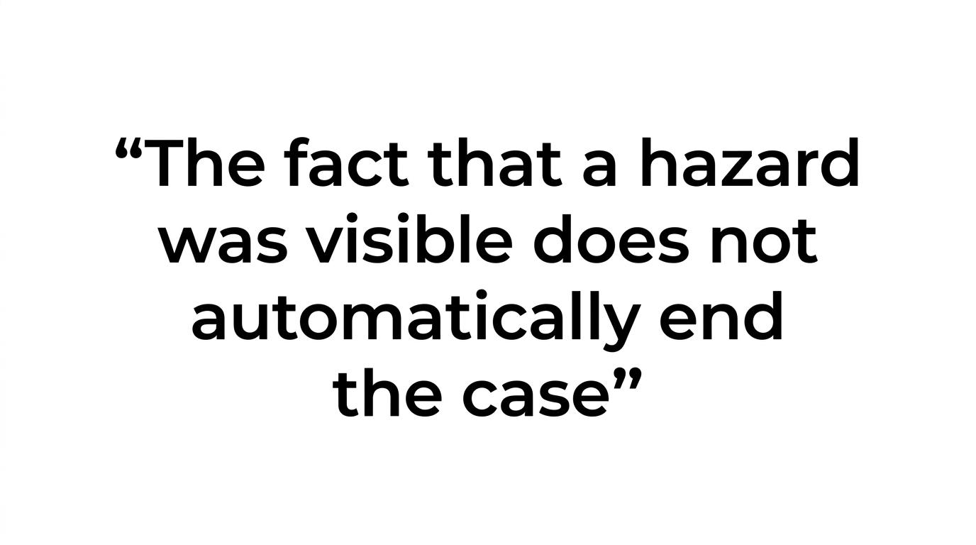Highlighted quote stating that a visible hazard does not automatically end a Michigan injury case.
